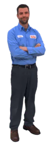 A man wearing a blue button-up work shirt and dark pants stands with his arms crossed, facing forward, ready to address any customer review or feedback.