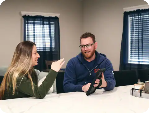 sila tech discussing cost with woman